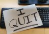 Federal Job Promise SHATTERS A resignation letter reading 'I QUIT' placed on a keyboard