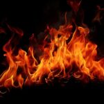 Bright flames dancing against a black background