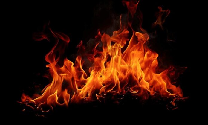 Fire,Flames,On,Black,Background Bright flames dancing against a black background