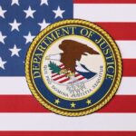 Department of Justice seal on American flag background