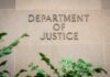 Department of Justice building wall with engraved lettering