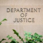 Department of Justice building wall with engraved lettering