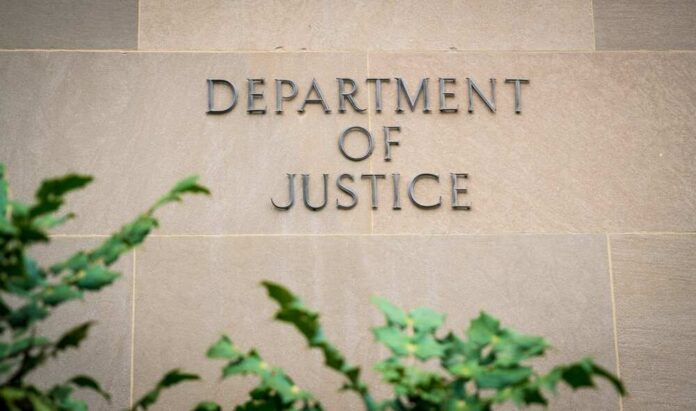 Department of Justice building wall with engraved lettering