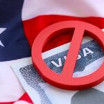 Visa Purge Targets Asylum Tactic U.S. Citizenship and Immigration Services building sign.
