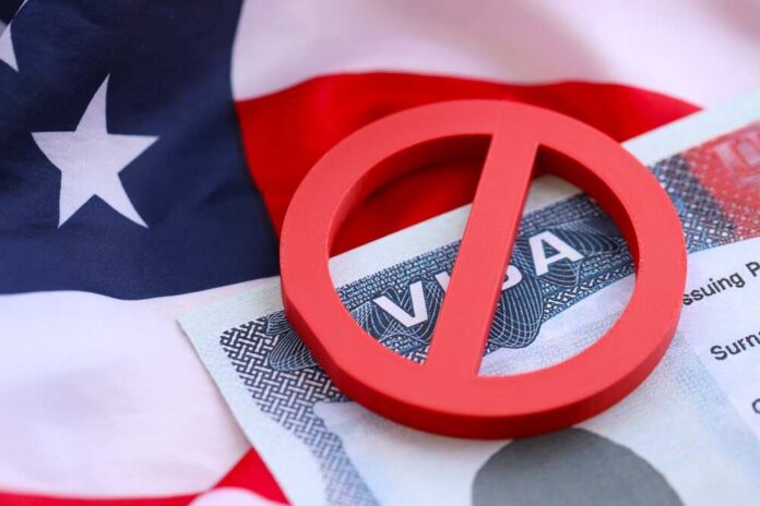 Visa,Ban,Concept.,United,States,Of,America,Visa,On,Passport U.S. Citizenship and Immigration Services building sign.