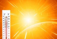 Nighttime Heat Wouldn’t Quit Thermometer displaying high temperature against a bright sun