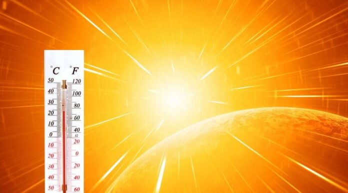 Thermometer displaying high temperature against a bright sun