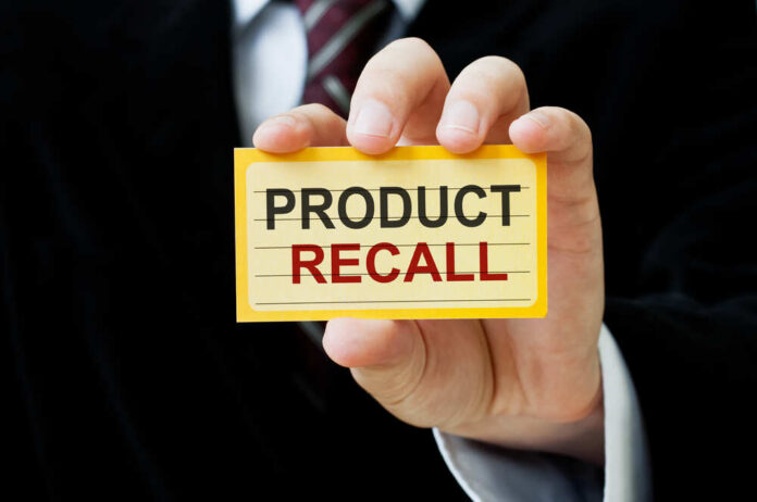Product,Recall Hand holding a product recall card