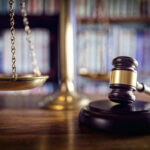 Scales and gavel on a judges desk.