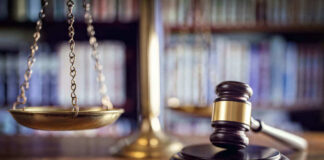 Scales and gavel on a judges desk.