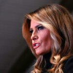 Melania Trump in a close-up side profile speaking
