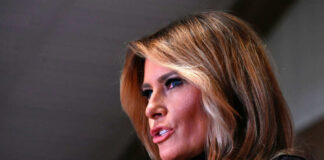 Melania Trump in a close-up side profile speaking