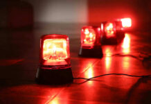 VIDEO: Holy Day Turns Horror — 10 Dead Red emergency lights on dark floor, illuminating the area.