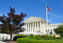 Trump Wins: Supreme Court Hands Him Victory United States Supreme Court building with columns and an American flag