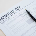 Bankruptcy Chapter 13 form with a pen resting on it