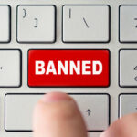 California’s Shocking Ban Sparks Showdown Red banned key on computer keyboard pressed