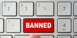 Red banned key on computer keyboard pressed