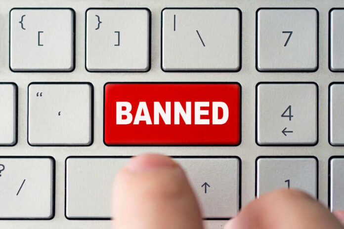 shutterstock_1790081768 Red banned key on computer keyboard pressed