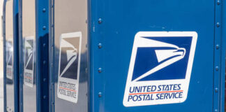 Row of blue United States Postal Service mailboxes