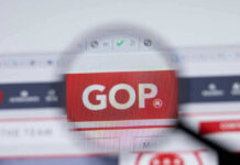 Court Greenlights Mail-Vote Overhaul — For Now Magnifying glass focusing on GOP website logo.