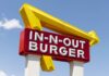 In-N-Out Tweaks Ingredients In-N-Out Burger sign with yellow arrow against blue sky