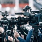 Jazz Legend’s Death at 95 Is Mourned Around the Globe Broadcast cameras on tripods at a press event