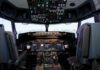 Interior view of an airplane cockpit with various instruments and controls