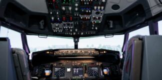 Interior view of an airplane cockpit with various instruments and controls