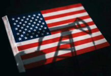 Oil Flows Back — Or Are They? American flag with oil pump shadow overlay.