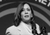Kamala Harris speaking at a podium with microphones