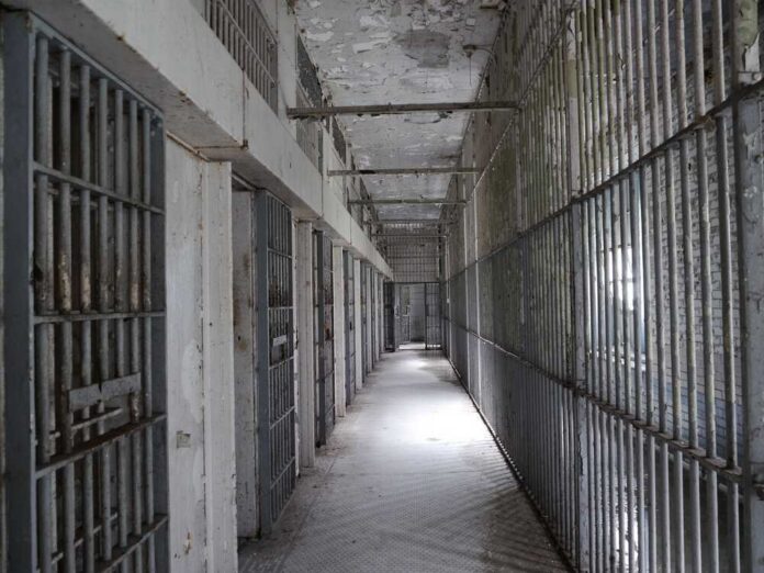 Vandalia,,Us,-,Mar,18,,2014:,The,Death,Row,At Empty prison corridor with barred cells on either side