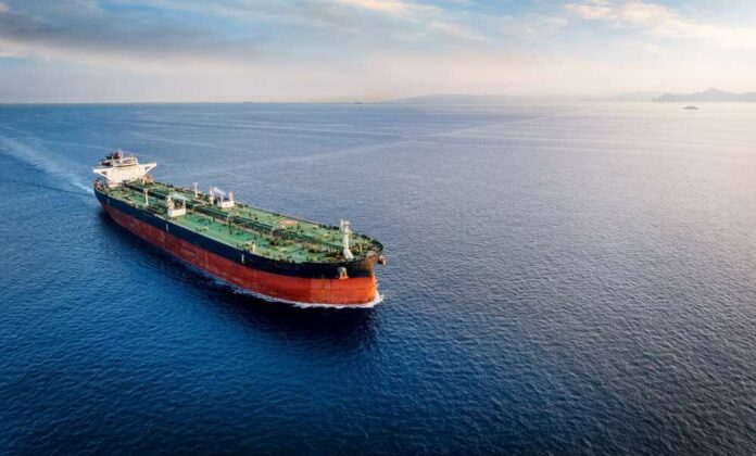 An oil tanker navigating through calm ocean waters