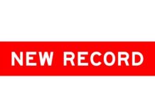 Record 401(k) Boom – But Who’s Actually Winning? Red ribbon banner with the text 'NEW RECORD'
