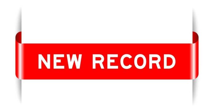 Red ribbon banner with the text 'NEW RECORD'