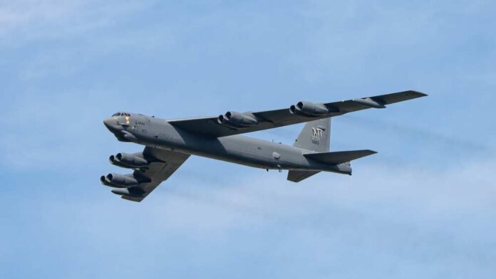 B-52 bomber flying against a blue sky