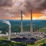 EPA Nukes Carbon Rules Overnight Coal-fired power plant with tall smokestacks at sunset