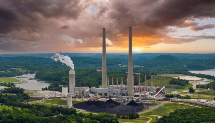 Large,Thermal,Kingston,Power,Plant,In,Roane,County,Near,Kingston, Coal-fired power plant with tall smokestacks at sunset