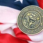 Navy Denial Shattered on Capitol Hill Navy medal resting on an American flag