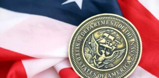 Navy medal resting on an American flag