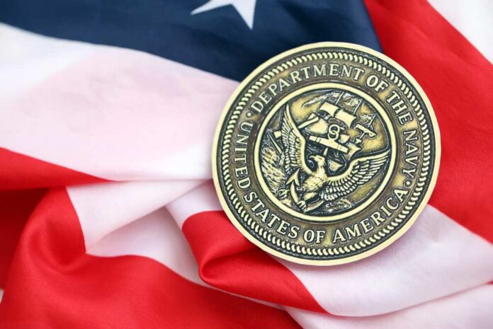 Kyiv,,Ukraine,-,October,7,,2025,Department,Of,The,Navy Navy medal resting on an American flag