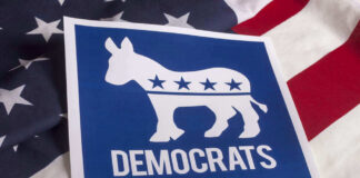 Democrats emblem on an American flag background.