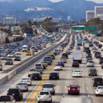 Trump Authorizes Cheaper Cars? Heavy traffic on a multi-lane highway.