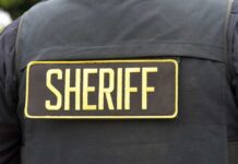 Close-up of a sheriff's uniform with a badge