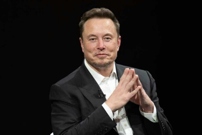 shutterstock_2318800323 Elon Musk in a suit talking.