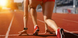Athlete on starting line of a track.