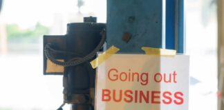 Sign stating 'Going out of Business' attached to a pole