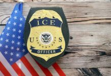 FBI Swarms ICE Building After THIS? ICE officer badge displayed next to the U.S. flag