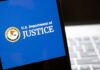 DOJ Blitz Hits Blue State Ballots U.S. Department of Justice logo on a smartphone screen