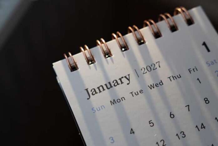 Close-up of a spiral-bound calendar opened to January 2027