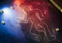 Crime scene chalk outline with numbered evidence markers.
